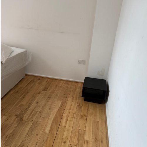 Clean bedroom with restored floor