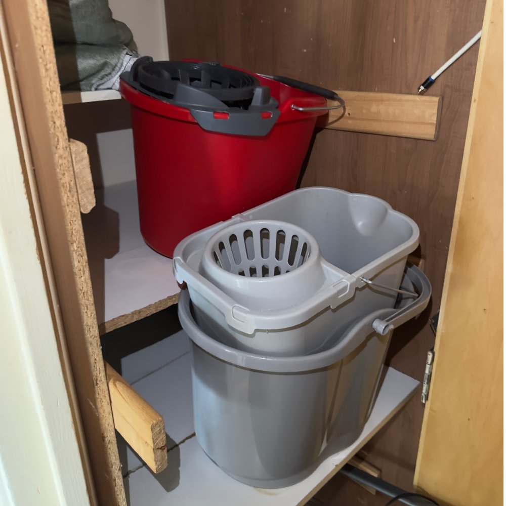 Cluttered storage cupboard