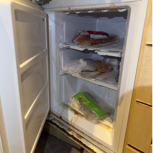 Dirty fridge with food stains