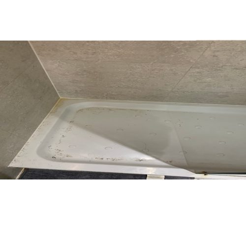 Grimy shower tray before cleaning