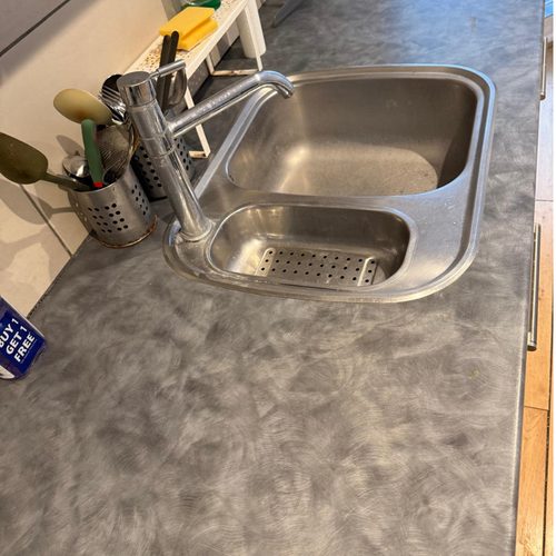 Stained kitchen sink before cleaning